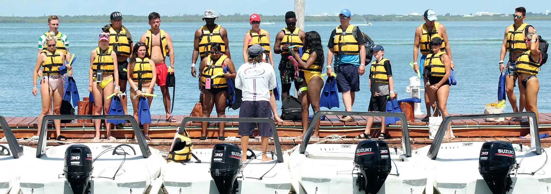 Tourists learning to drive speedboats in Cancun
